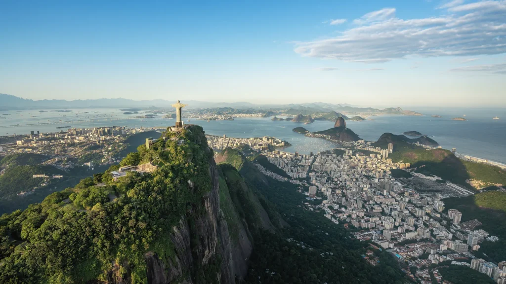 Aerial view of Christ the Redeemer statue and Sugarloaf Mountain overlooking Rio de Janeiro's coastline